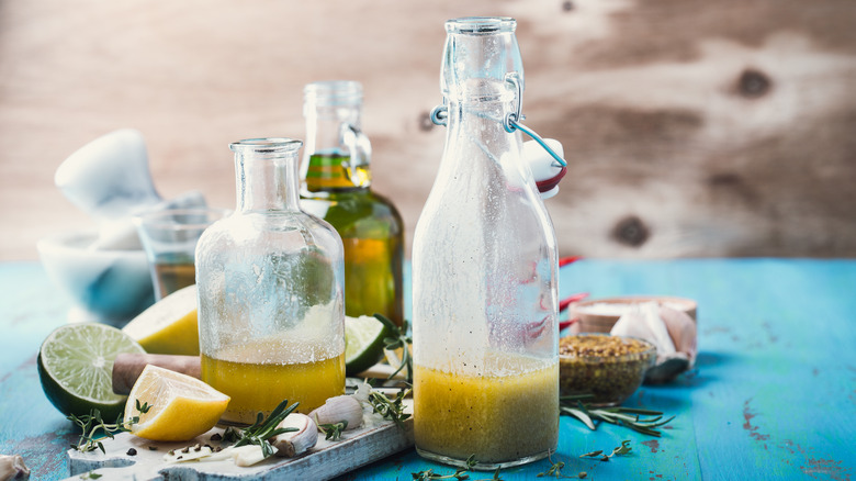 Homemade dressing bottles on table