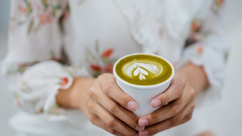 Woman with matcha latte