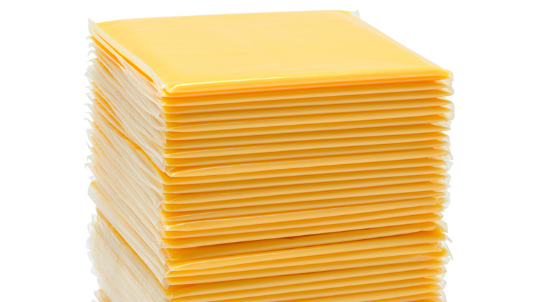 A stack of American cheese individually wrapped in plastic