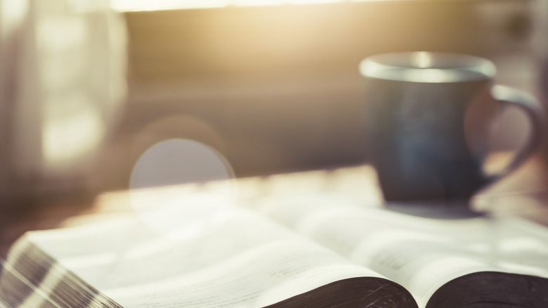 Cup of coffee on a book