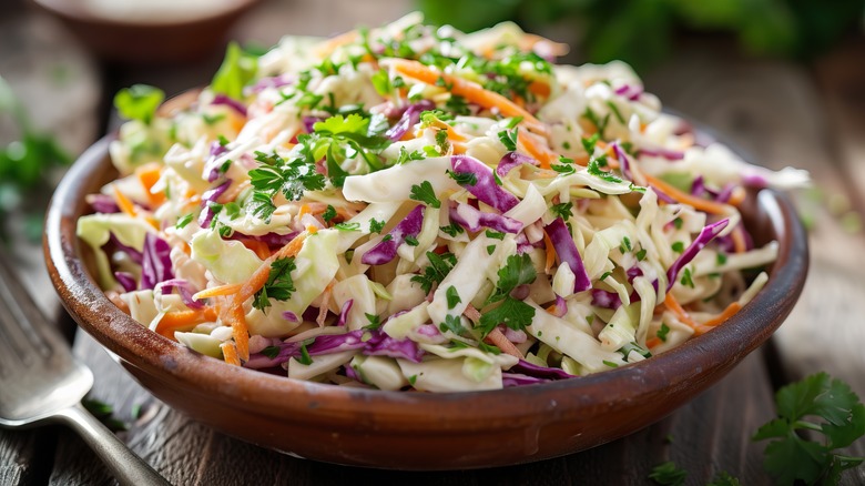 Vibrant coleslaw in wooden bowl