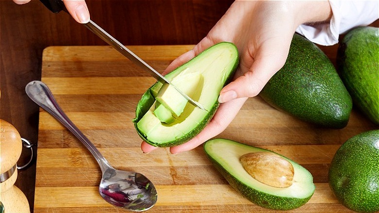 Avocado sliced in skin 