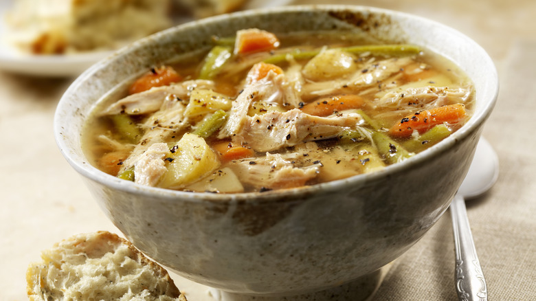 Chicken and vegetable soup in ceramic bowl