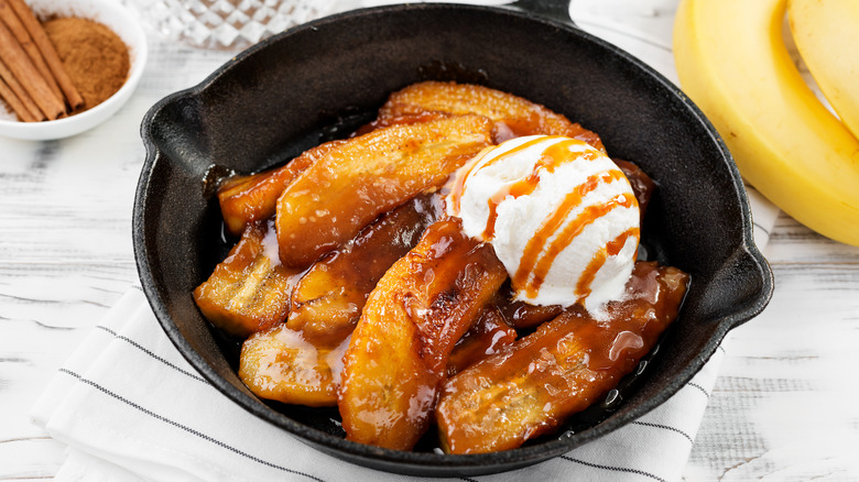 Caramelized banana with ice cream in a cast iron skilled