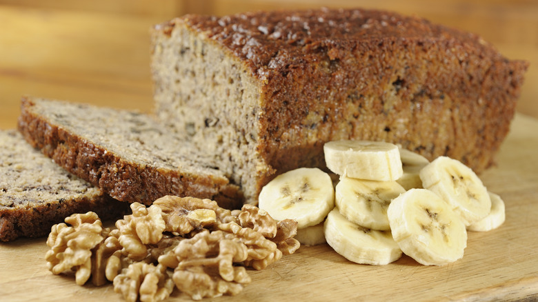 Loaf of banana bread with bananas and walnuts