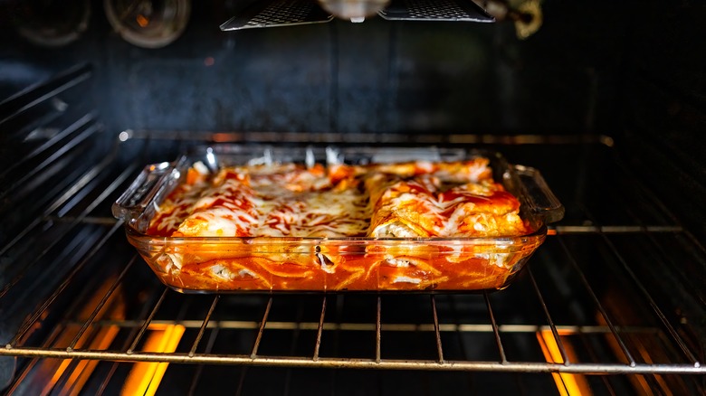 A dish of enchiladas in the oven