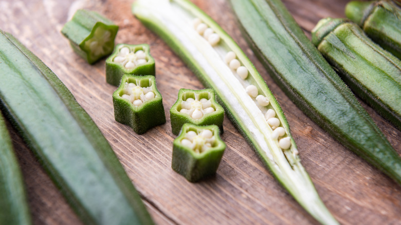 fresh okra on wooden surface