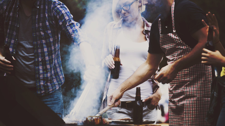 Friends grilling and drinking beer