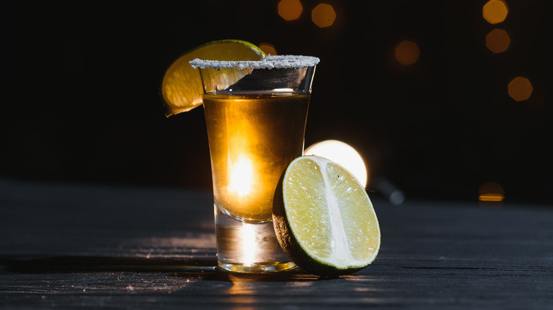 Shot of tequila with a lime and salted rim