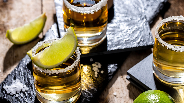 tequila in a shot glass with lime and salt