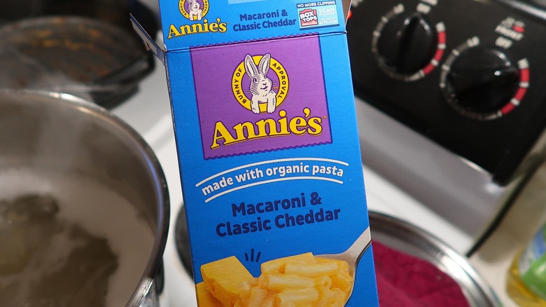 Blue box of Annie's mac'n cheese against stoce