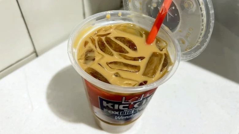 Pumpkin Spice Frosty Coffee in takeout cup