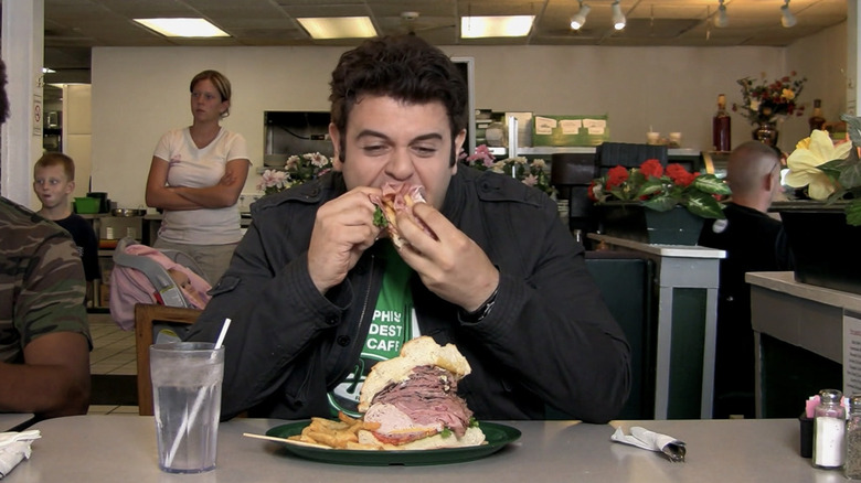 Adam eating Dagwood sandwich