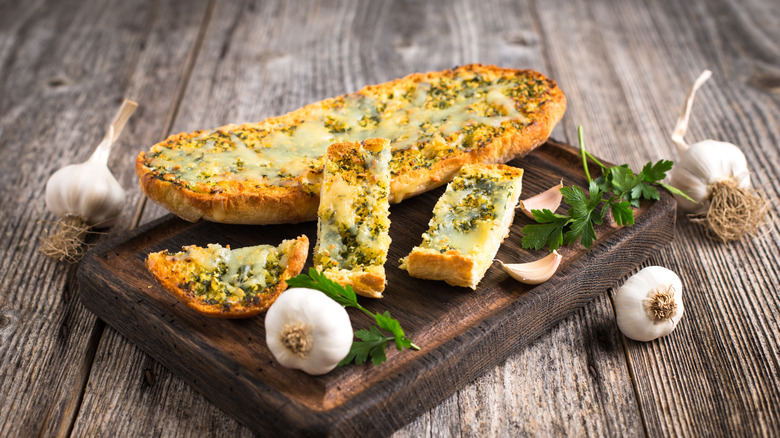 Garlic bread on wood board