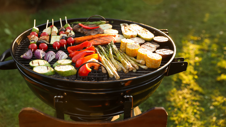 mixed veggies including asparagus and mushrooms on outdoor grill