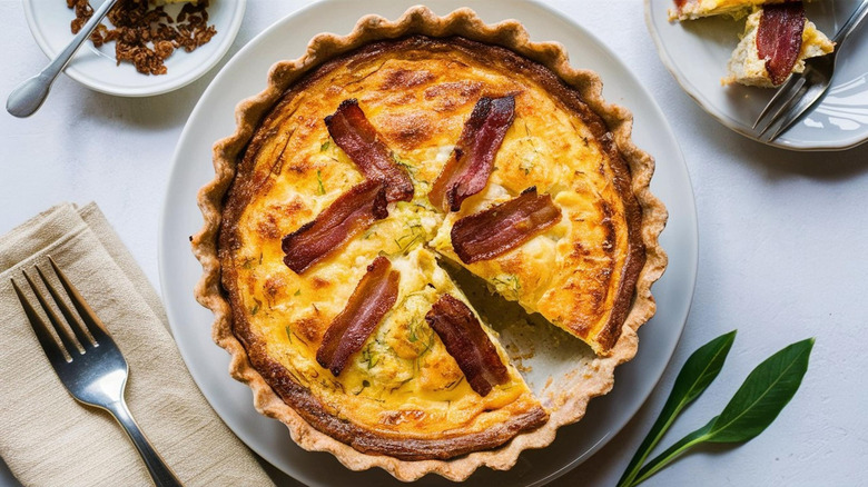 sliced bacon quiche on tabletop