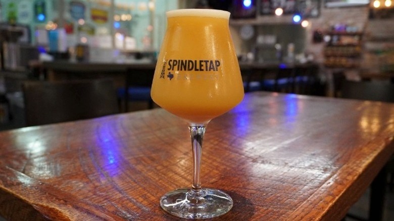 SpindleTap Brewery glass on bar