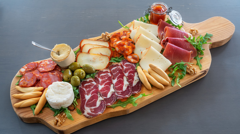 cheese board, cured meat, olives