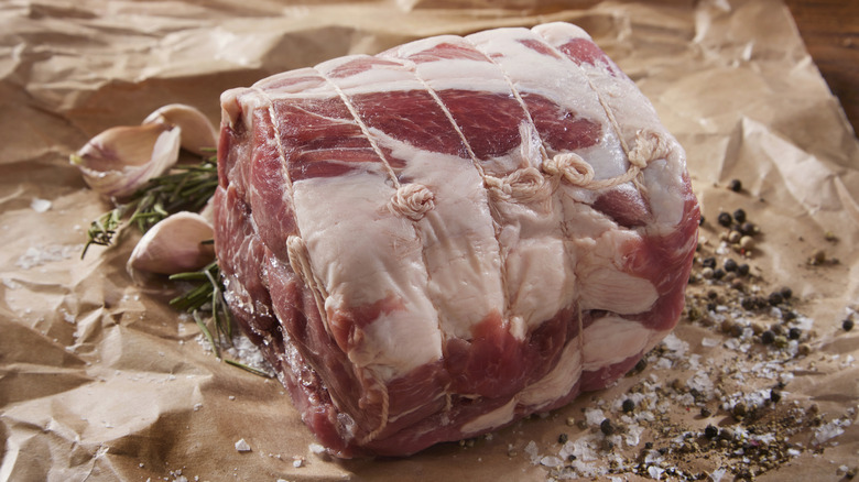 Raw pork shoulder on parchment