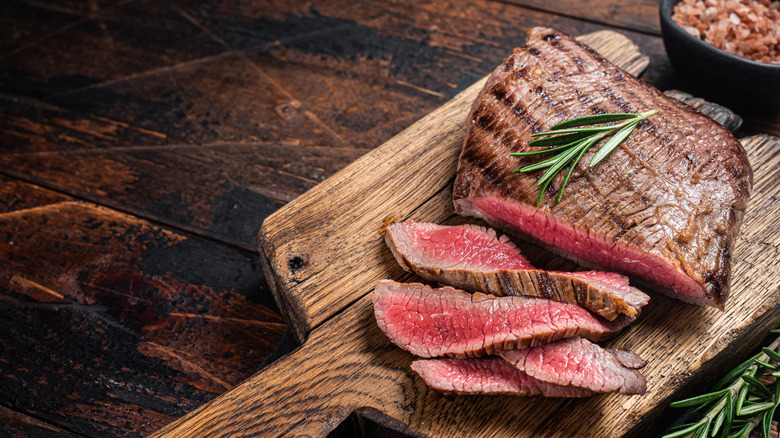 Grilled flank steak on board