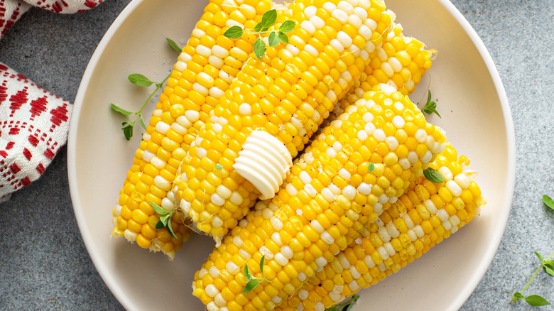 Corn on the cob with a ridged pat of butter