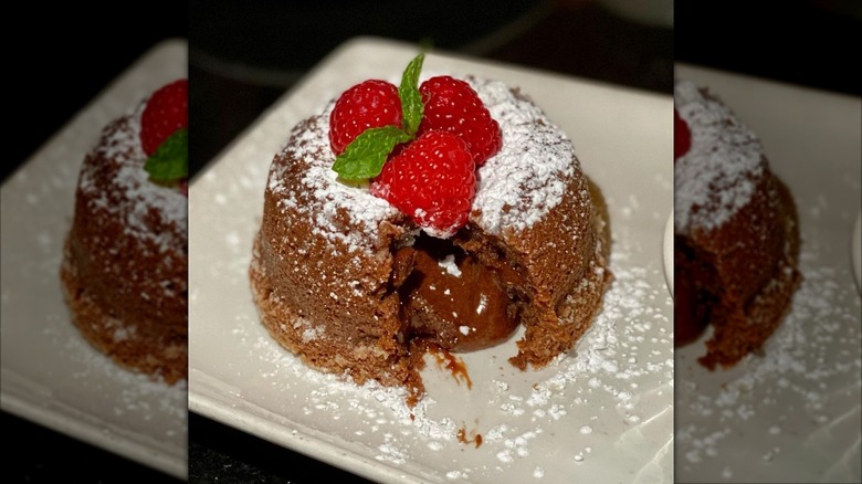 Morton's The Steakhouse Legendary Hot Chocolate Cake with raspberries on a plate