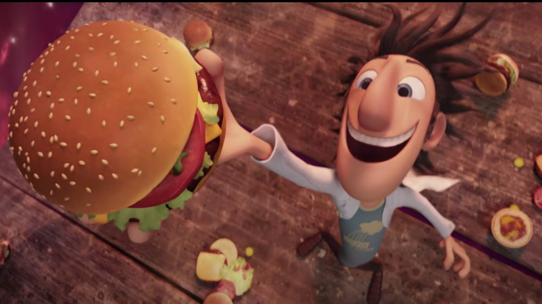 Cartoon man catching falling hamburger