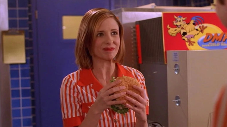 Buffy holding a hamburger
