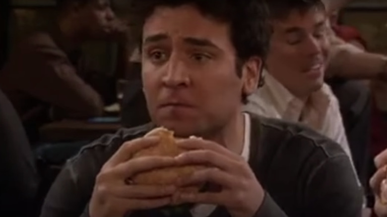 Ted Mosby holding a burger