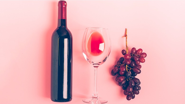 Red wine with glass and grapes 