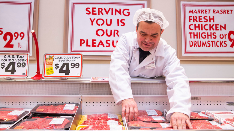 Market Basket butcher with meat