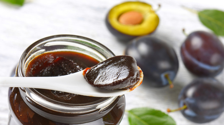 spoonful of prune butter surrounded by prunes