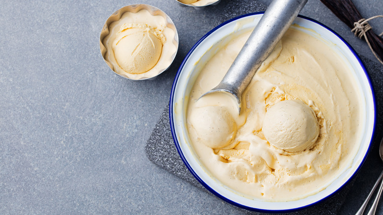 Scooping homemade vanilla ice cream