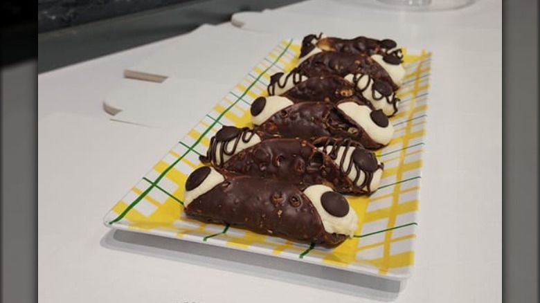 Chocolate cannoli on plate