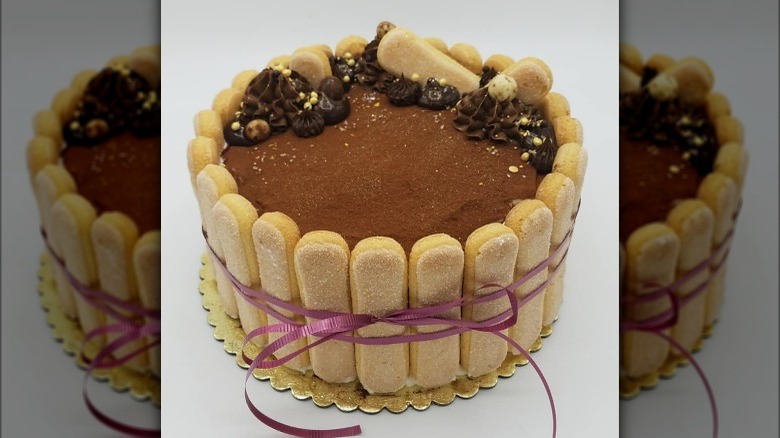 tiramisu cake with purple ribbon