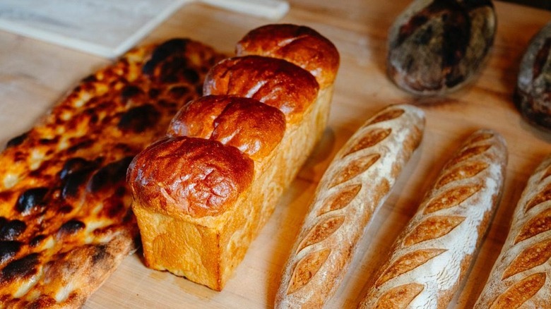 Assorted bread loaves on table