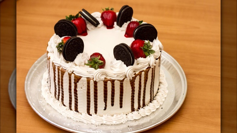 Cake topped with strawberries and Oreos