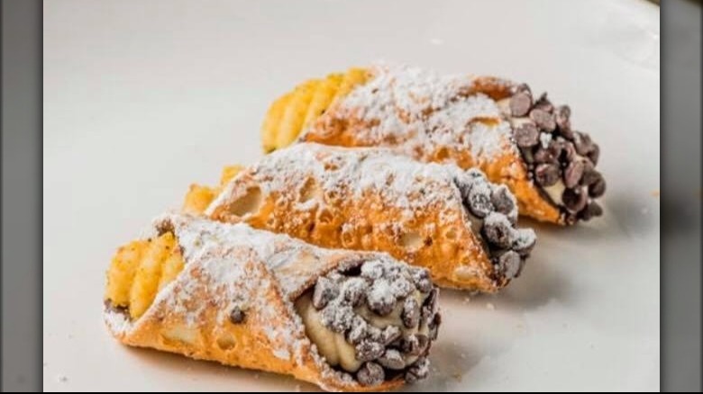 Three cannoli with chocolate chips