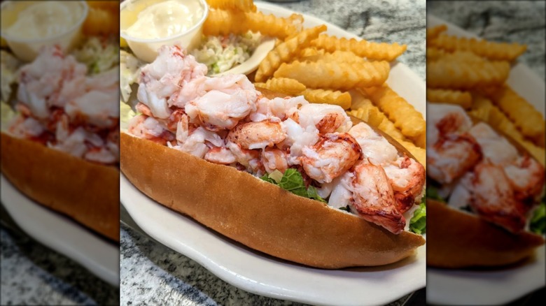 Fresh lobster roll with crinkle-cut fries