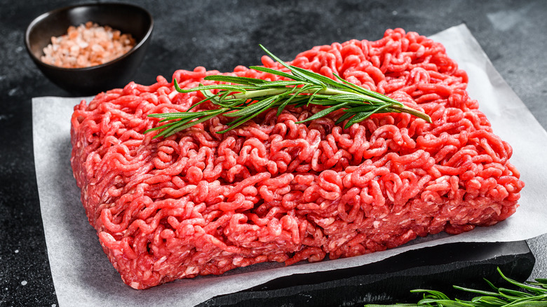 Raw ground meat with rosemary