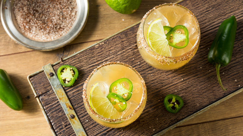 cocktails on a board with jalapenos