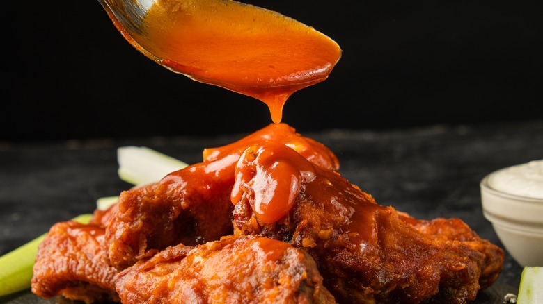 Buffalo wings topped with sauce 