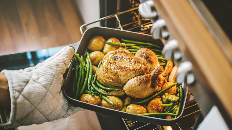 putting small chicken in oven