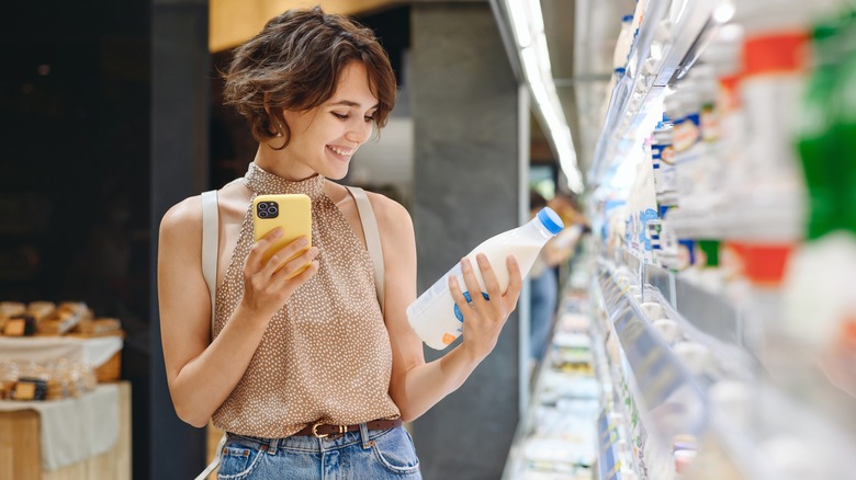 Person shopping for milk