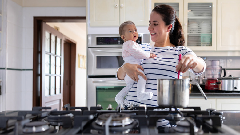 woman cooking soup at home