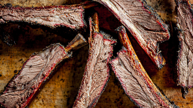 Beef ribs on wooden board