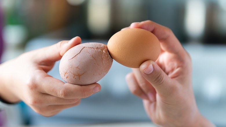 Cracking two eggs together