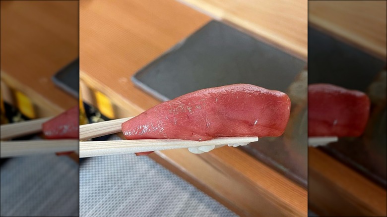 Nigiri being held by chopsticks