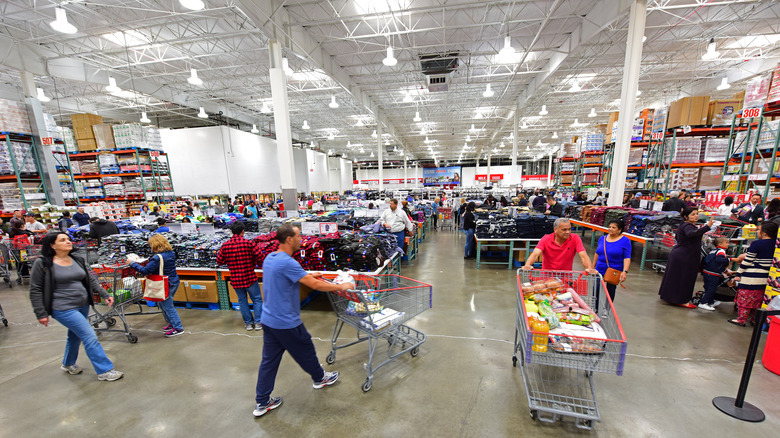 customers with shopping carts in Costco