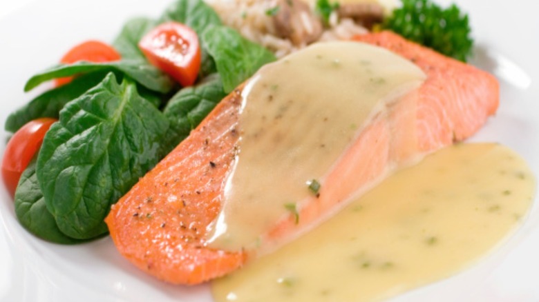 Poached salmon in pan sauce